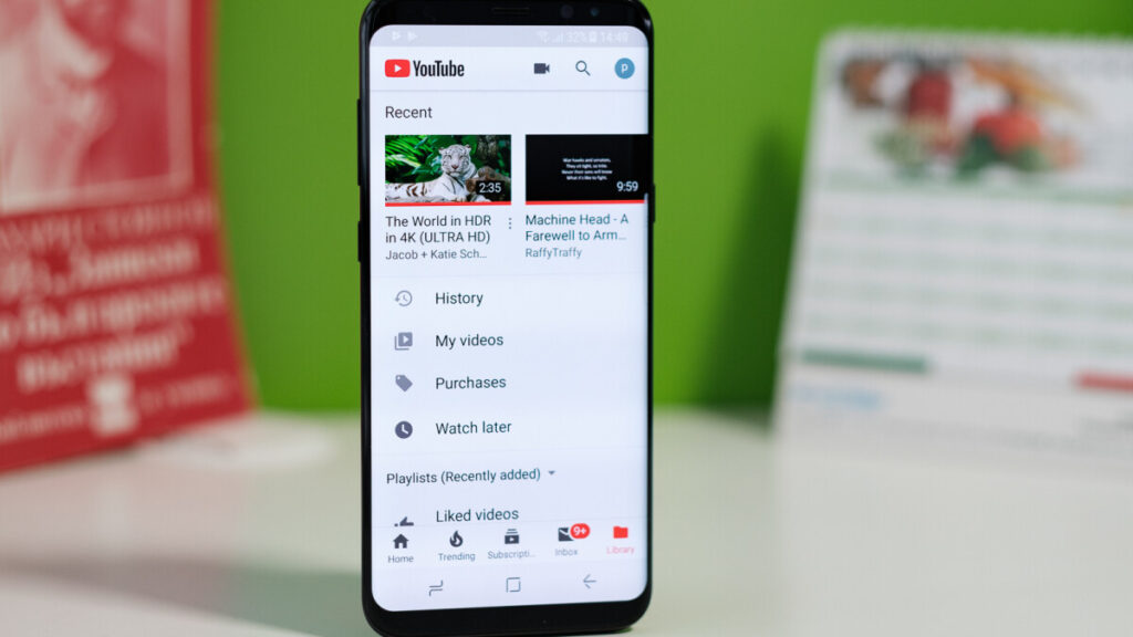 A screenshot of the YouTube Premium app with a download youtube video button highlighted.